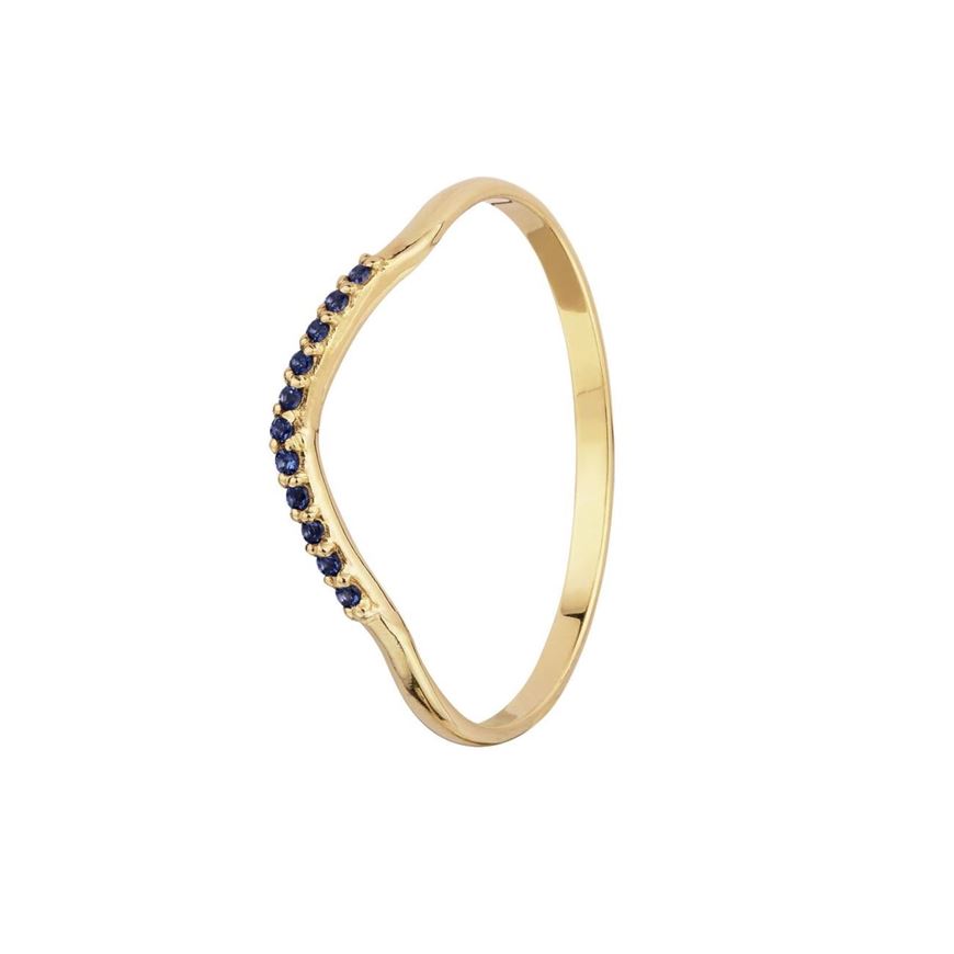 Foto de Sortija curvada de oro amarillo 18kt y circonitas azules