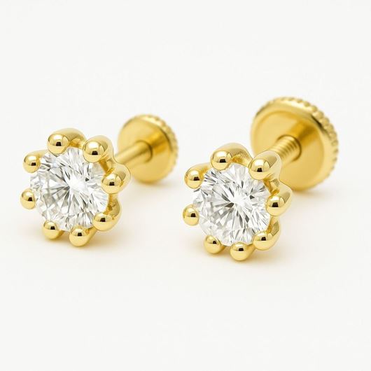 Foto de Pendientes de bebé Puntos de luz de 8 garras en oro amarillo 18kt y circonitas blancas