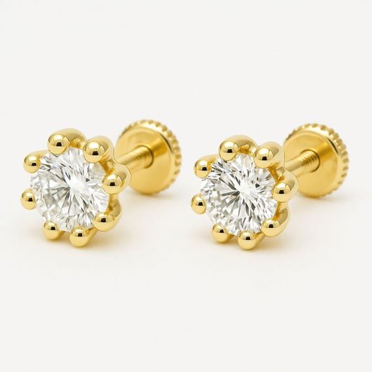 Foto de Pendientes de bebé Puntos de luz de 8 garras en oro amarillo 18kt y circonitas blancas