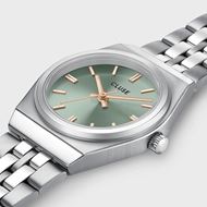 Foto de Mini reloj retro de los años 70, de acero, color verde salvia y plateado